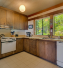 #9 Kitchen with stove and windows view